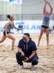 Action shot at a beach volleyball match.